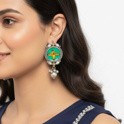 Dhvija silver oxidised winged bird drop earrings detail – ethnic jewellery by TelaNaari