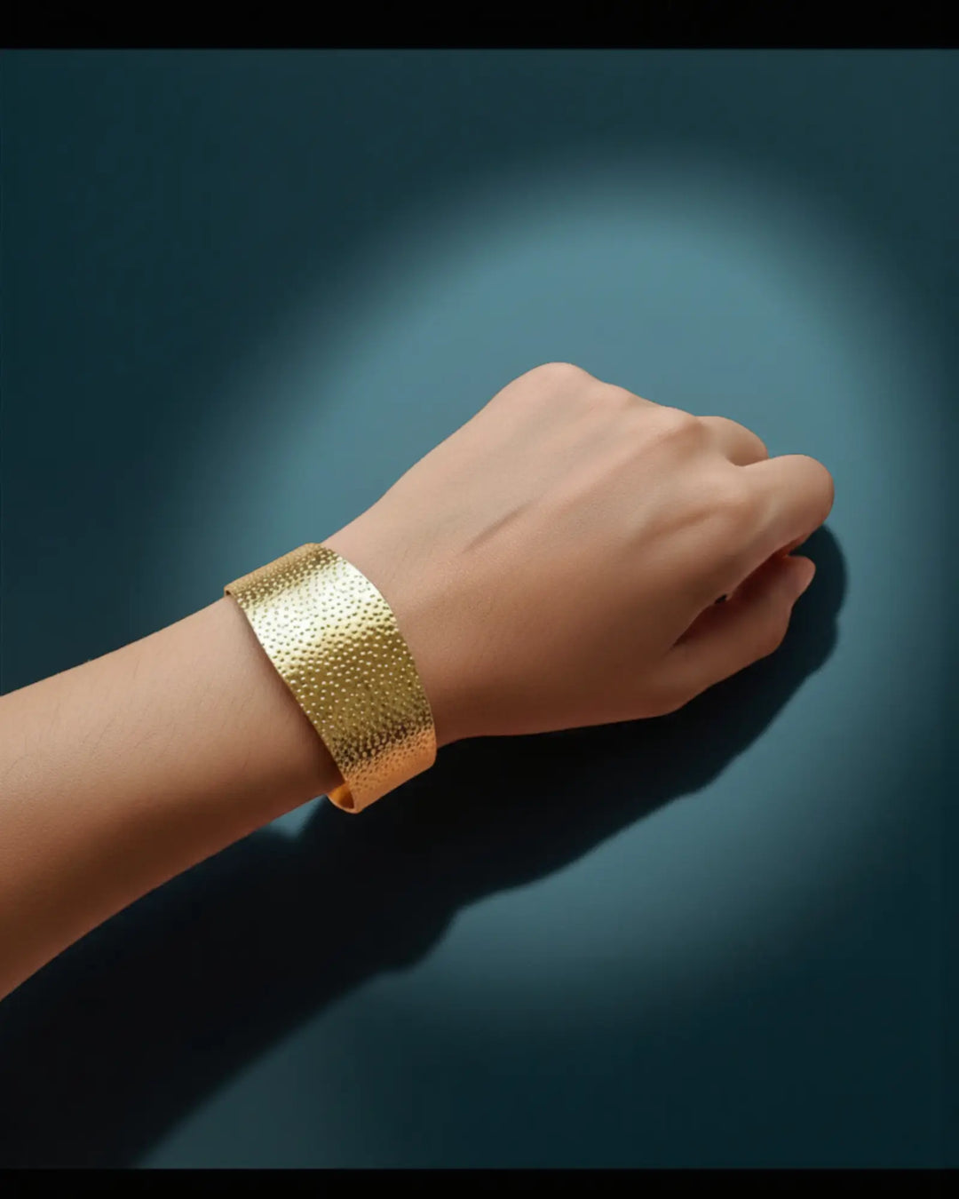 Anti-tarnish gold cuff bracelet worn on wrist, dotted texture design