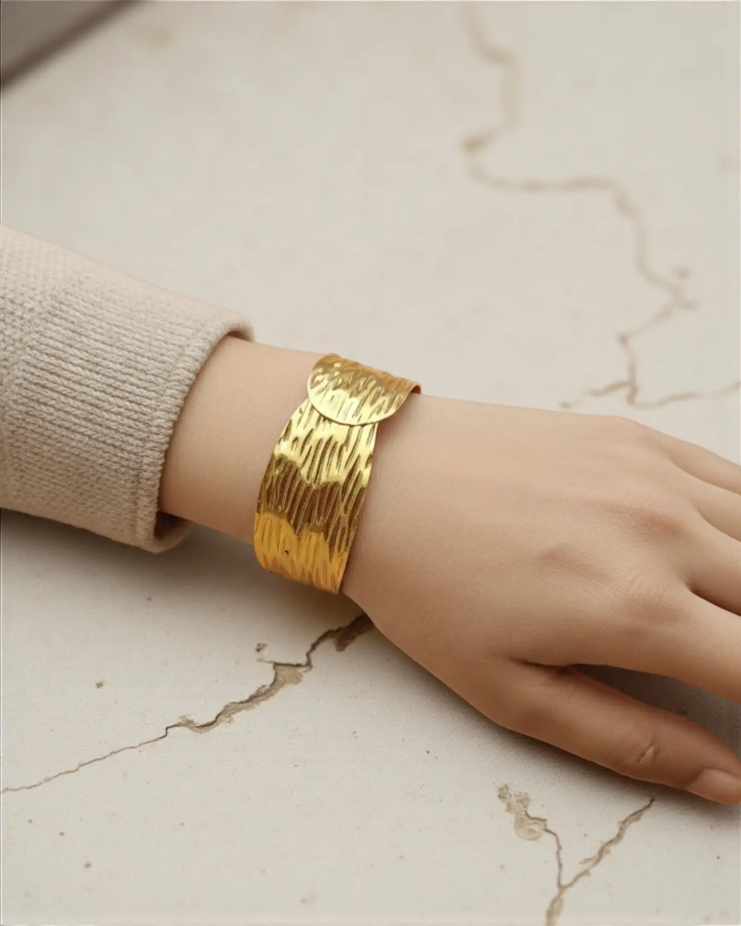 Crinkle texture anti-tarnish gold wide cuff bracelet worn on wrist