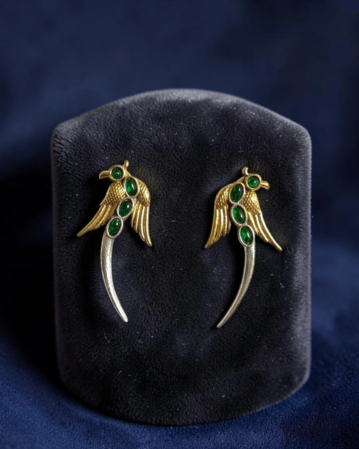 Dual tone golden wing bird dangle earrings flat lay – festive ethnic jewellery by TelaNaari