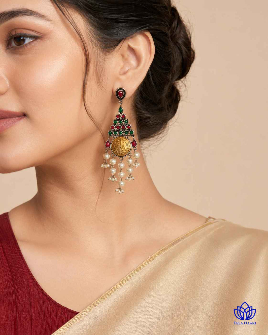 Sleek elongated silhouette defines this dual-tone dangler earring.