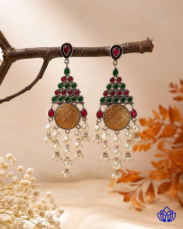 Layered plating creates a soft two-tone finish on this earring.