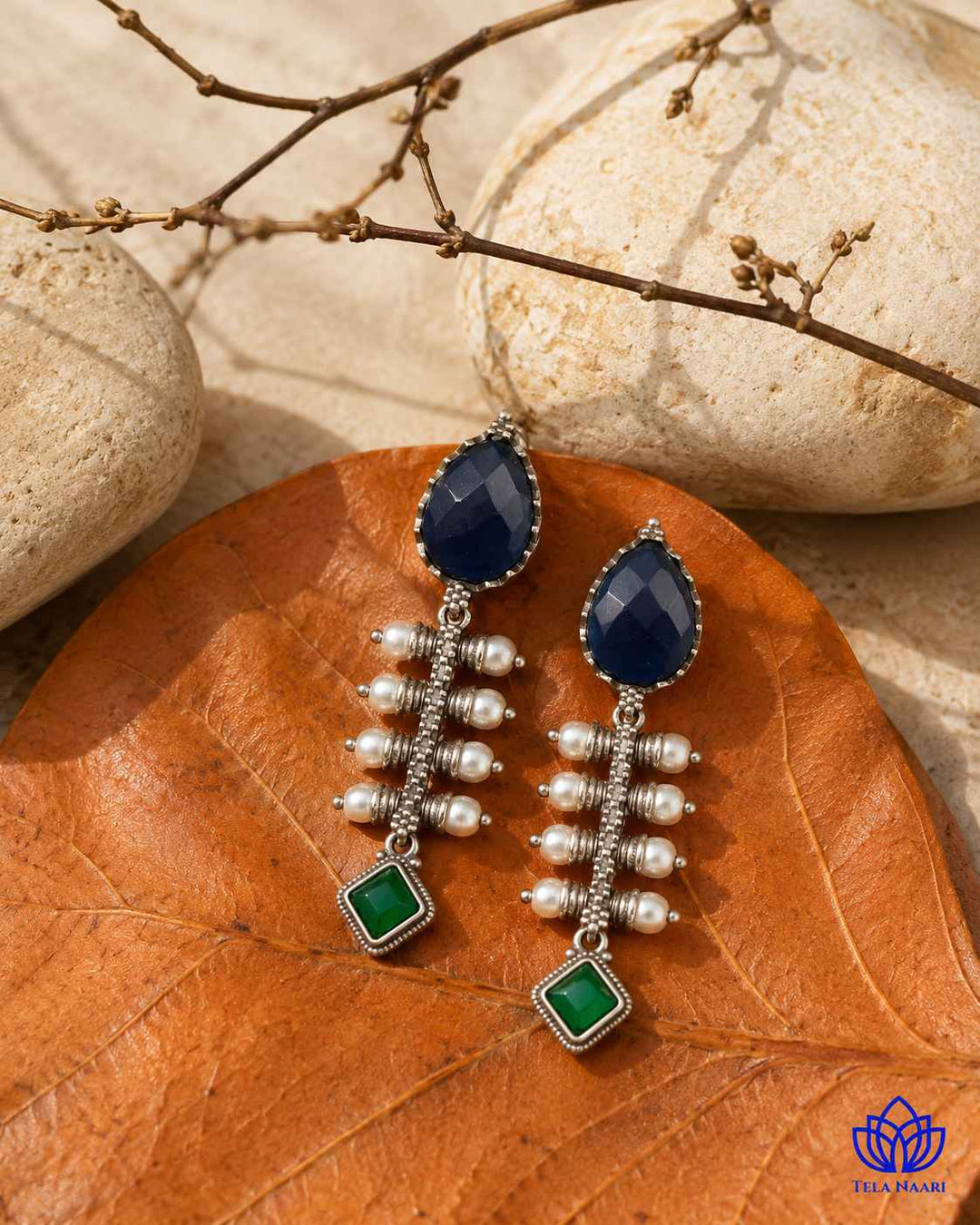 Push-back stopper closure secures this silver-plated teardrop earring.