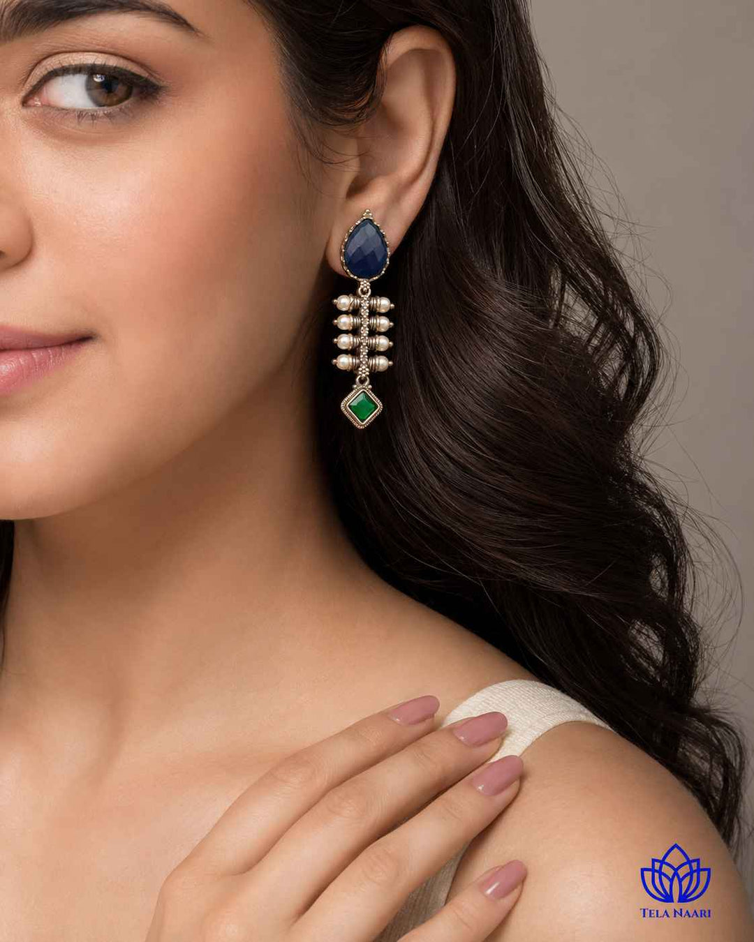 Silver-plated finish covers the smooth surface of this teardrop earring.