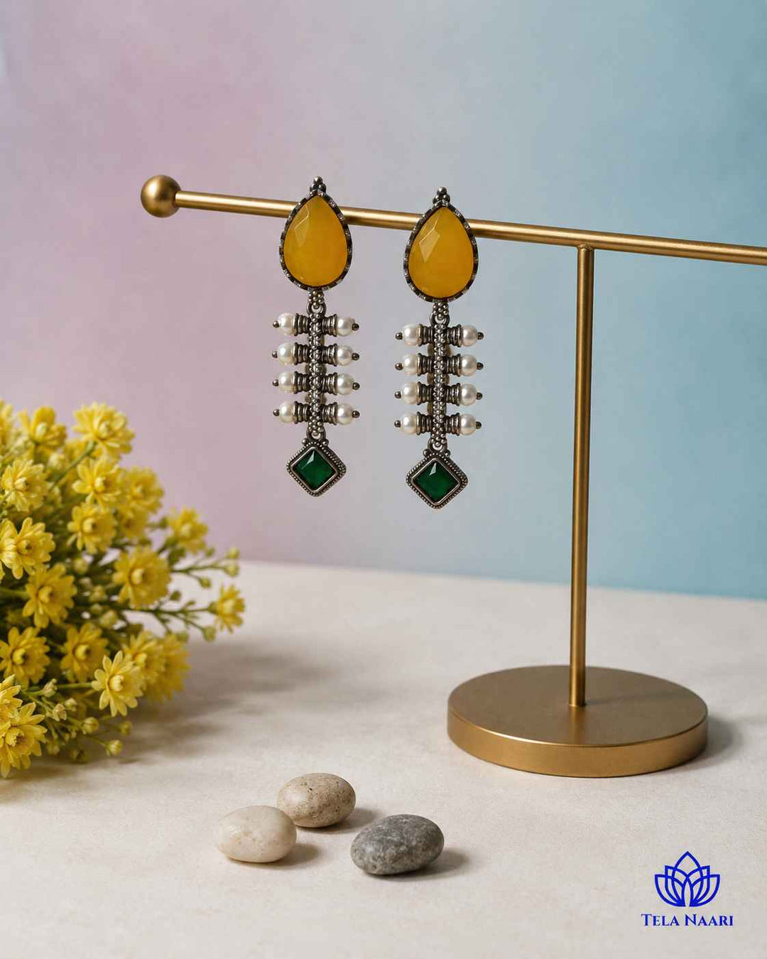 Push-back stopper closure secures this silver-plated teardrop earring.