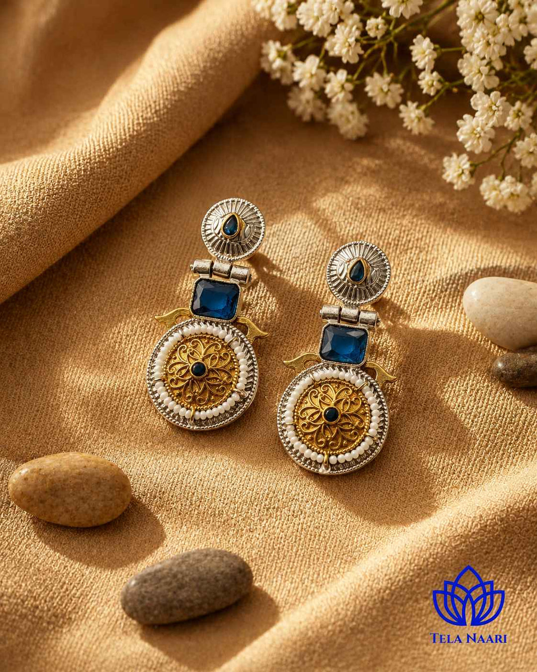 Brass construction underlies the oxidised dual-tone plating on this earring.