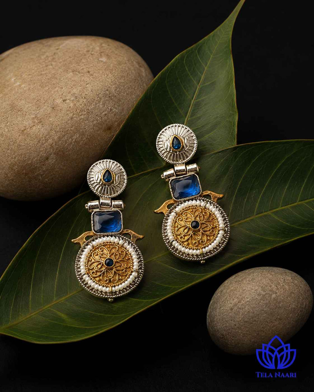 Blue tone contrasts against the layered silver oxidised finish.