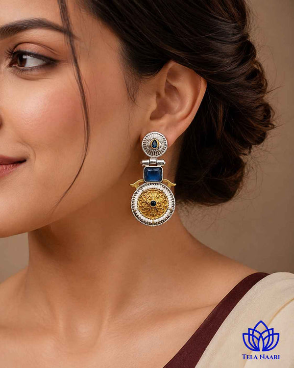 Dual-tone finish gives this blue earring a bold, layered look.