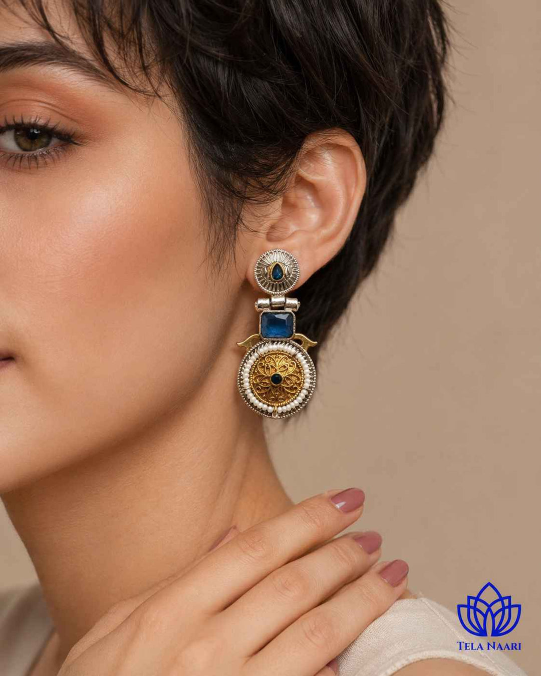 Push back closure keeps this dual-tone earring comfortable and secure.