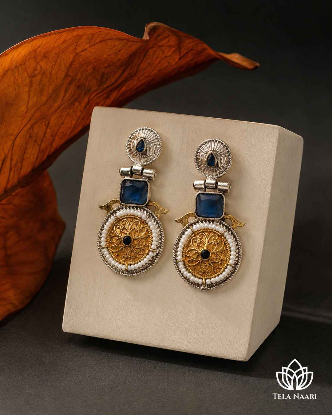 Statement silhouette highlights the dual-tone plating throughout the design.