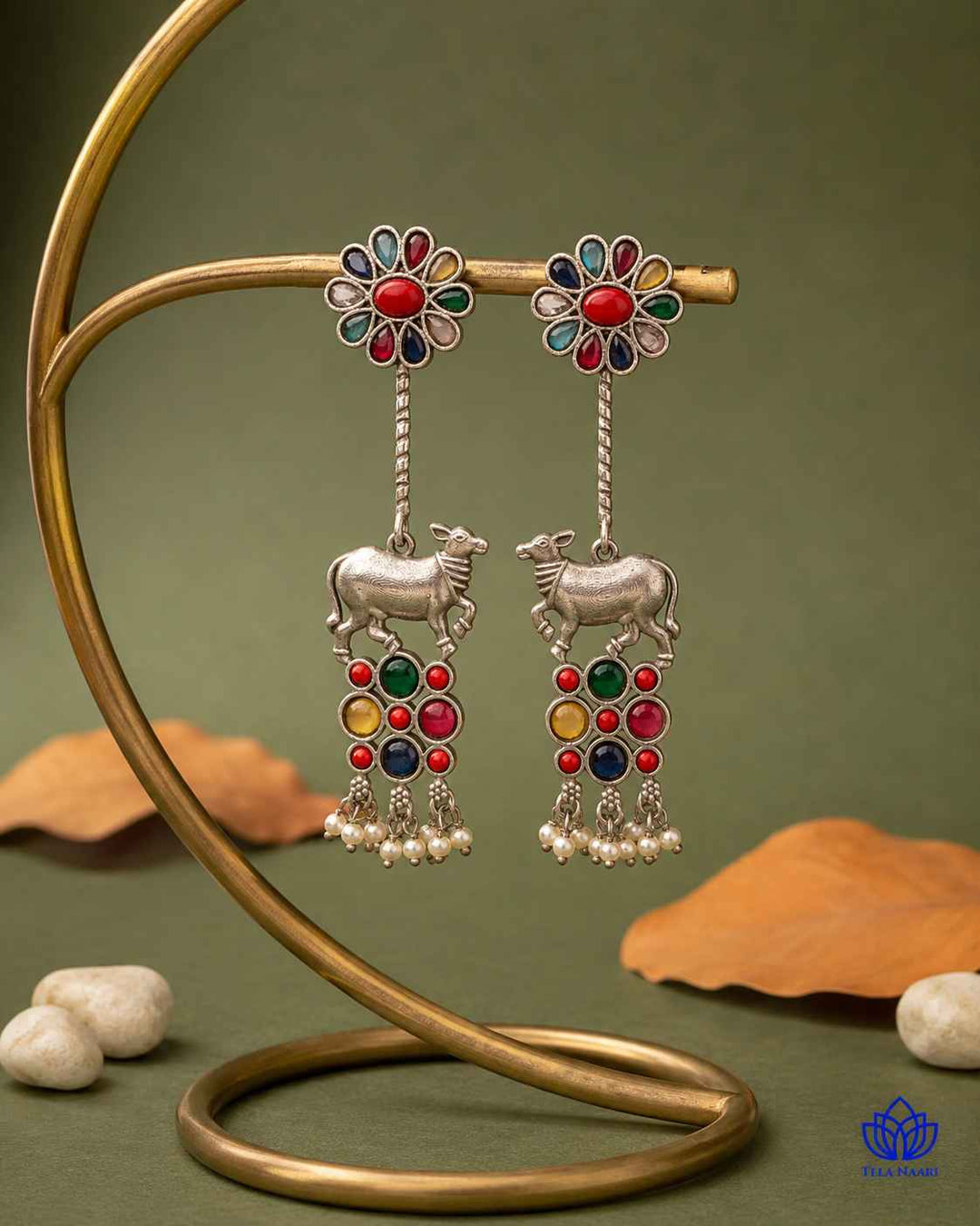 Bold bull silhouette pairs brass with a silver oxidised finish.