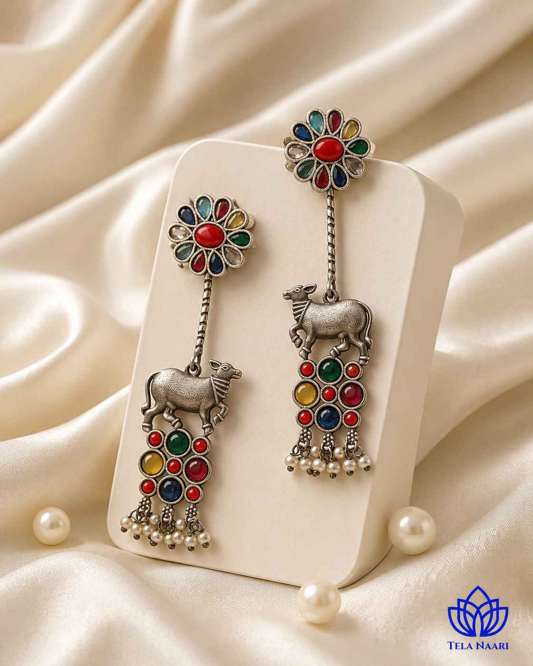 Folk-inspired Nandi motif shapes the silhouette of this earring.