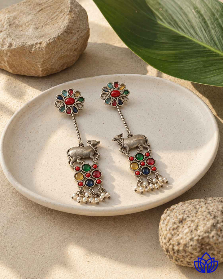 Quirky bull motif brings conversation-starting charm to this earring.