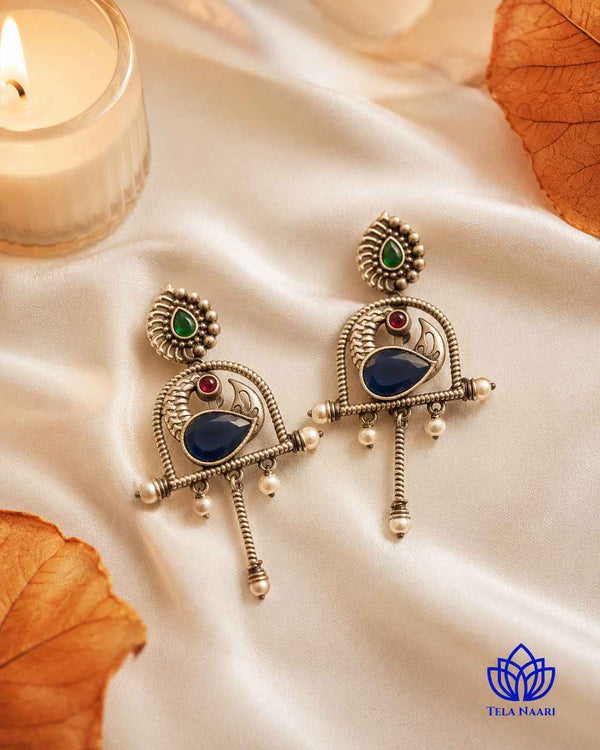 Playful and expressive, this quirky blue earring adds character to any look.