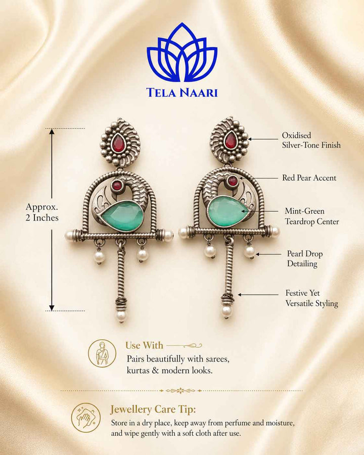 Brass construction supports the oxidised finish of this green earring.
