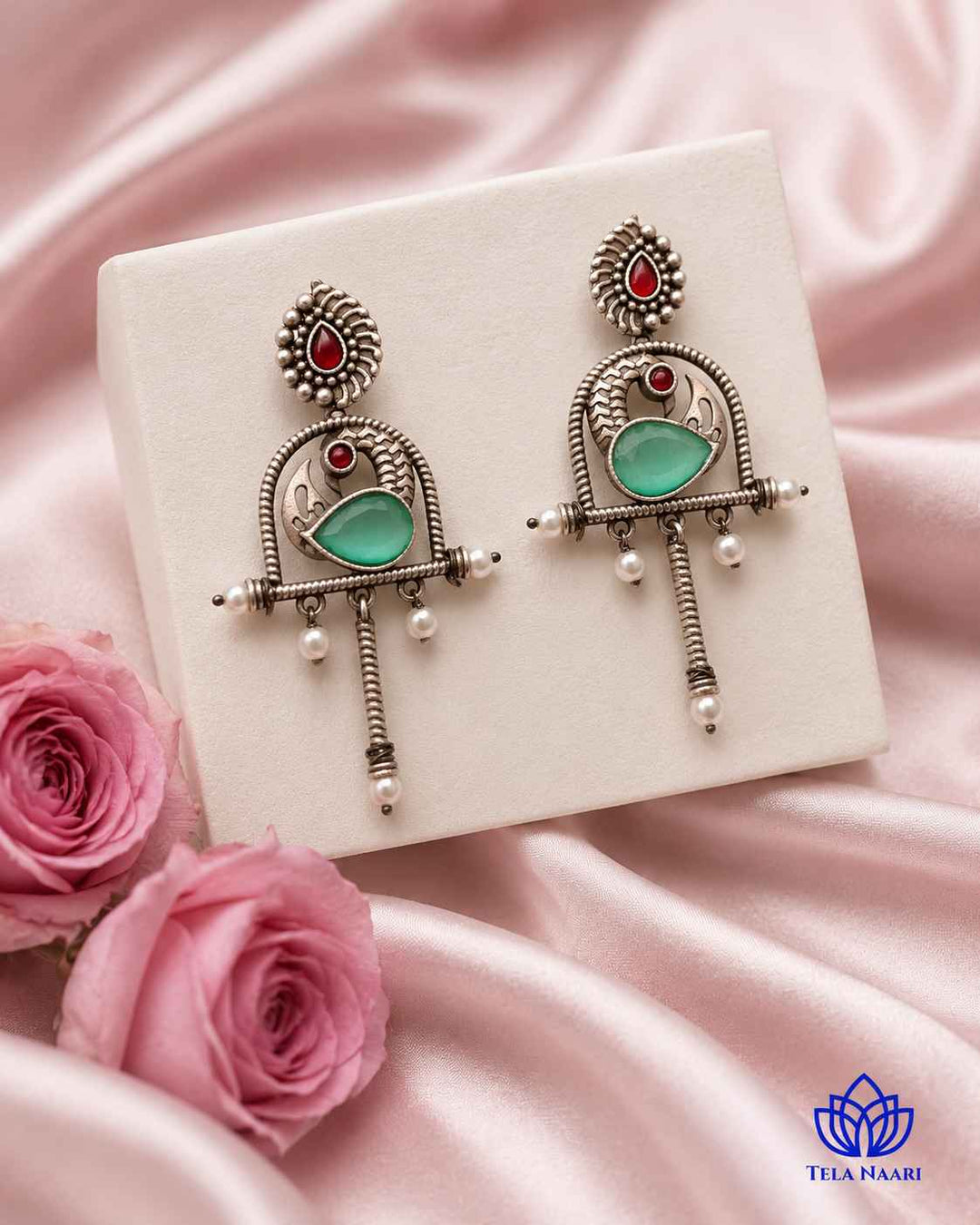Expressive silhouette gives this oxidised green earring its playful design.