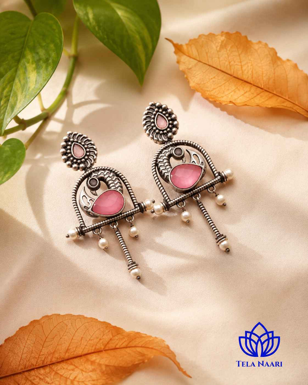 Quirky silhouette gives this oxidised pink earring its bold personality.