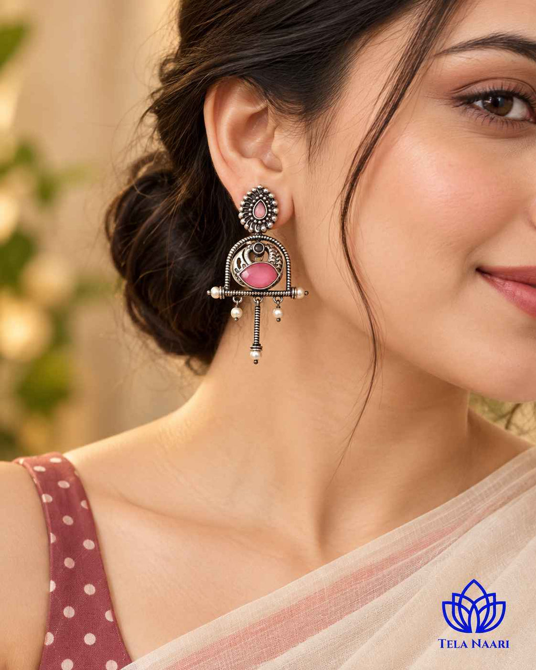 Quirky glass bead and stone detailing shapes this oxidised pink earring.