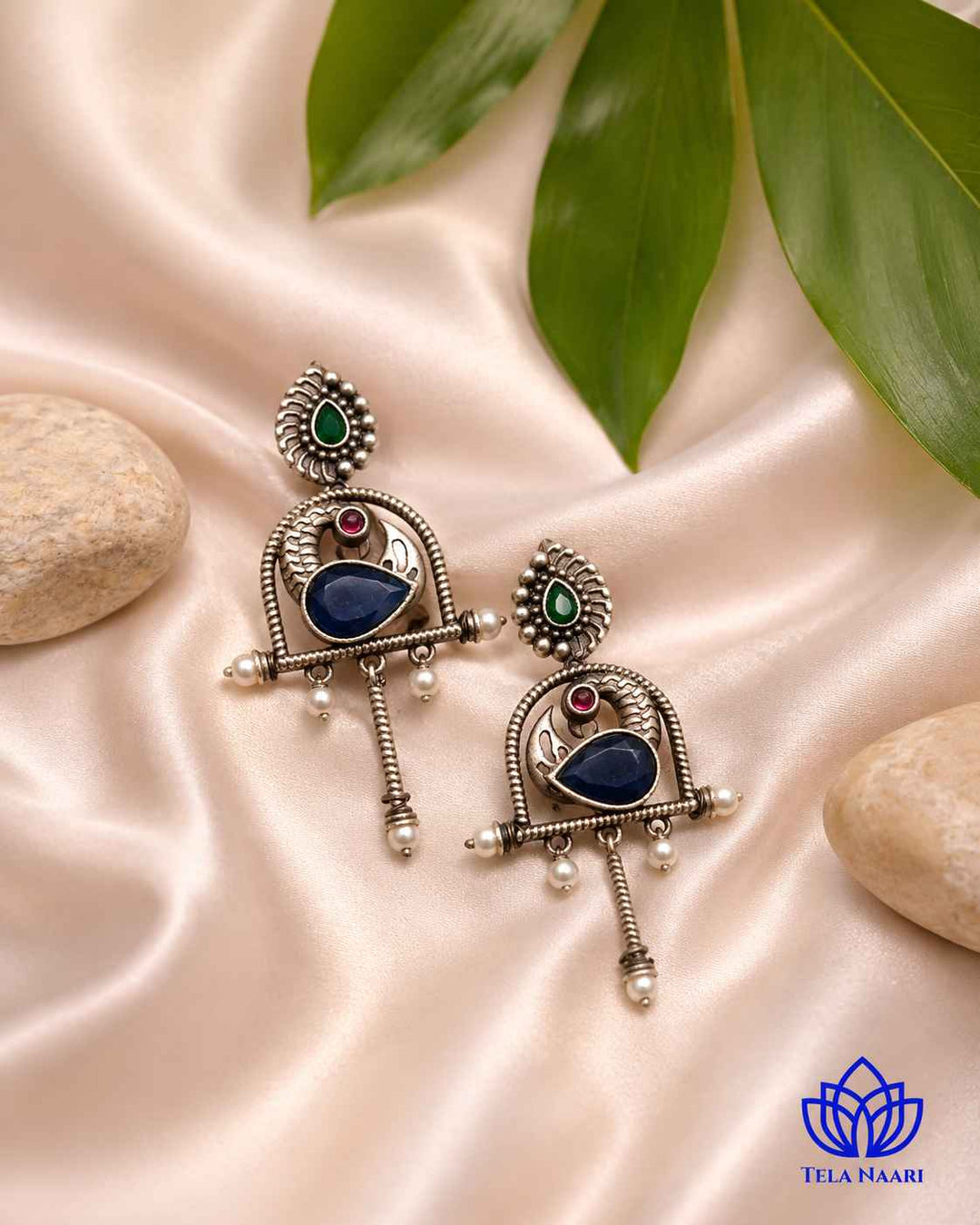 Everyday character comes through in this playful blue silhouette earring.