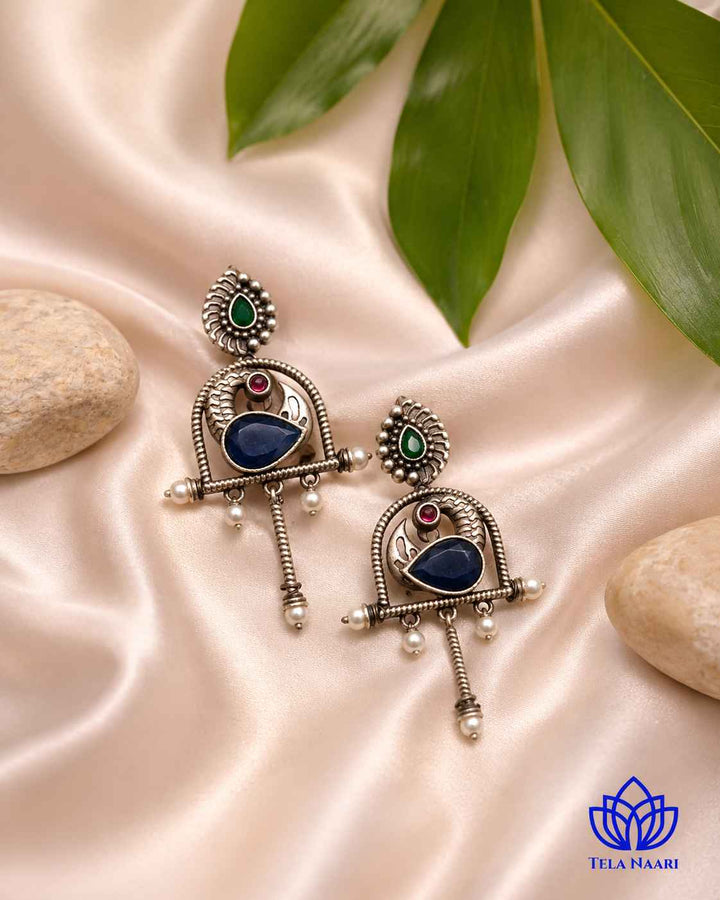 Everyday character comes through in this playful blue silhouette earring.