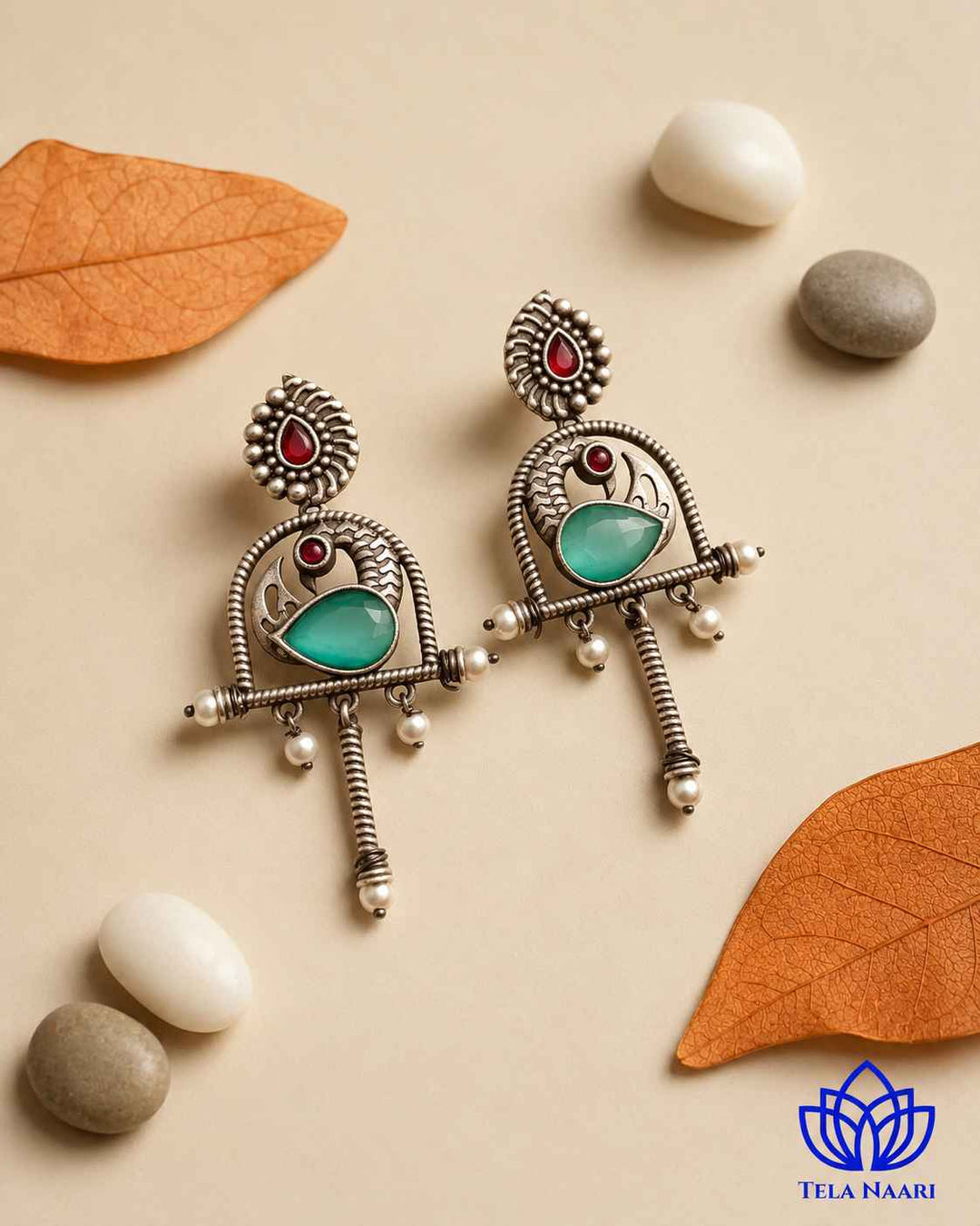 Quirky silhouette pairs brass with an oxidised green finish.