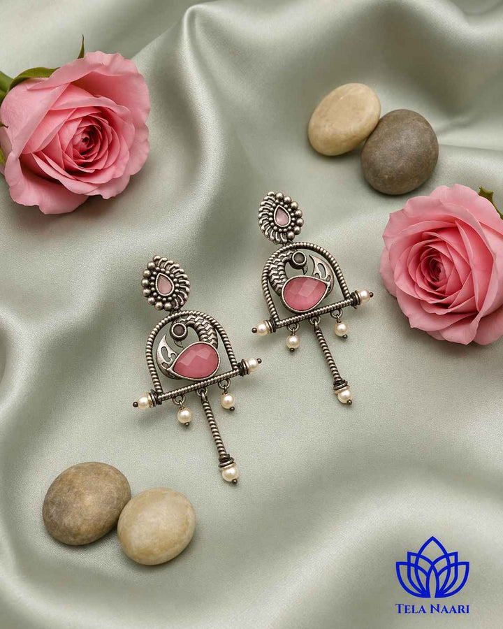 Textured surface combines glass beads with oxidised pink detailing.