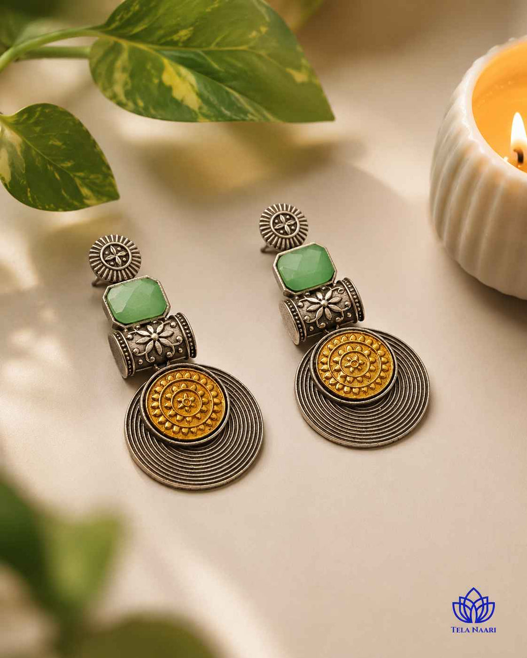 Bold green accents stand out against the silver-plated tone.