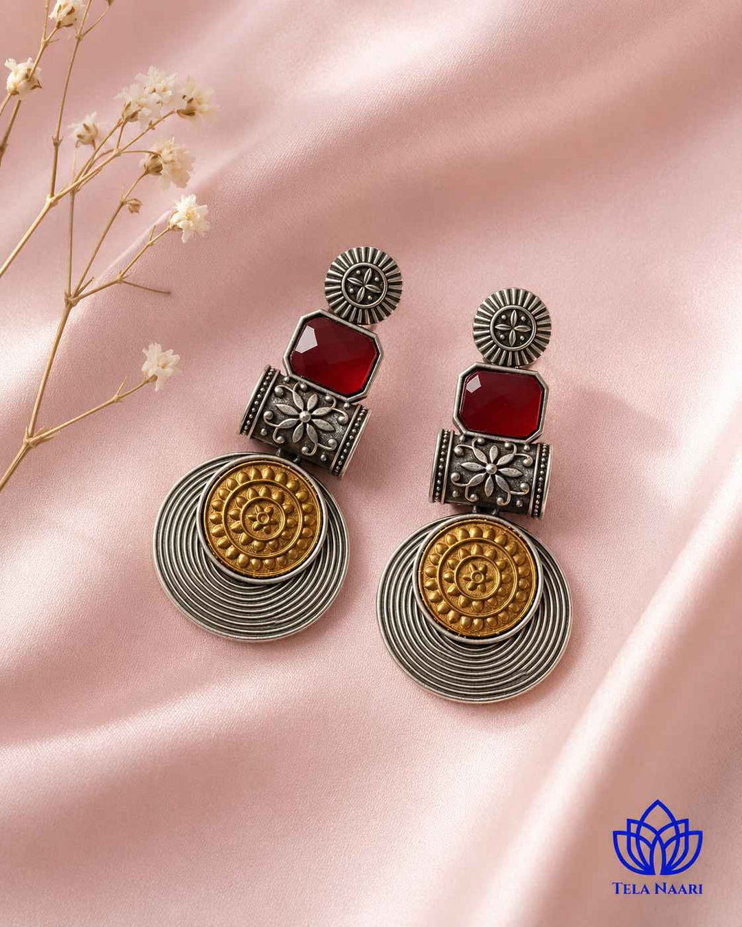 Metallic contrast defines the two-tone finish of this earring.