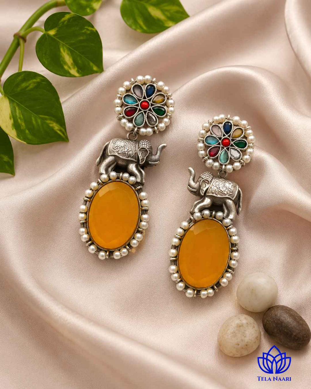 Charming elephant detailing sits within a lightweight silver-plated frame.