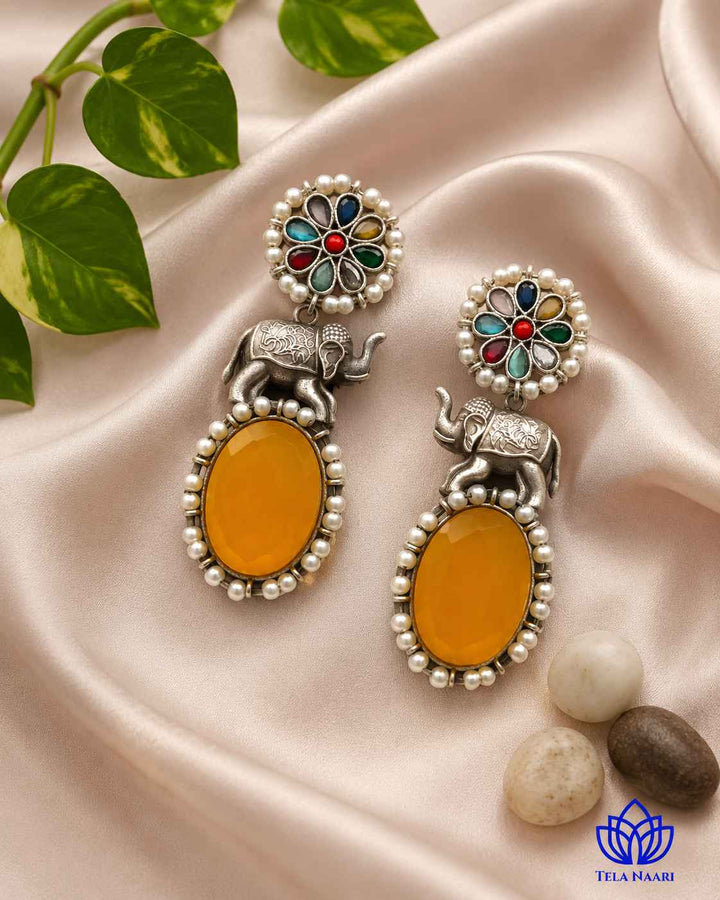 Charming elephant detailing sits within a lightweight silver-plated frame.