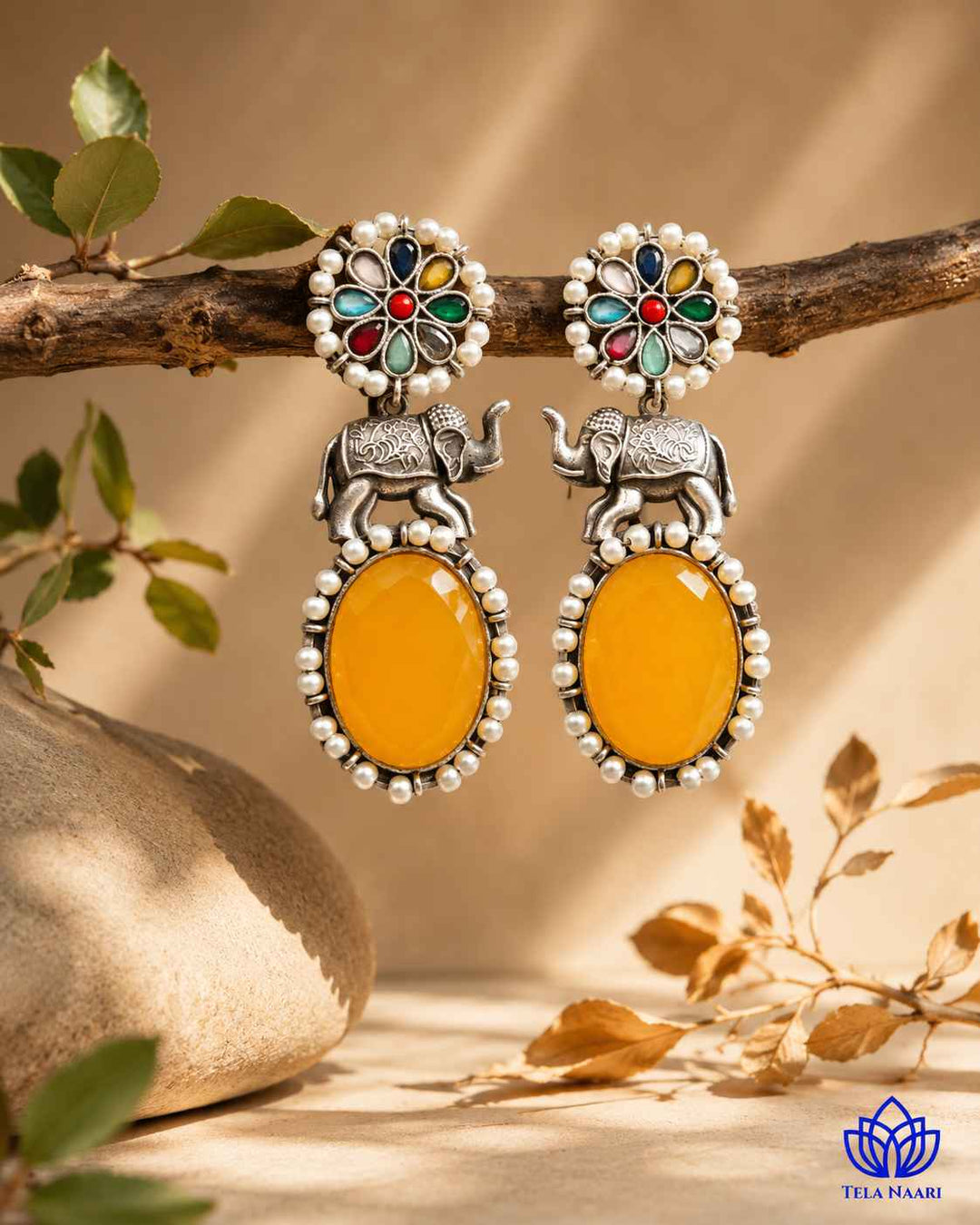 Glass bead and stone accents highlight the elephant motif clearly.