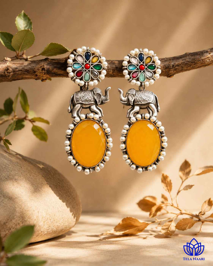 Glass bead and stone accents highlight the elephant motif clearly.