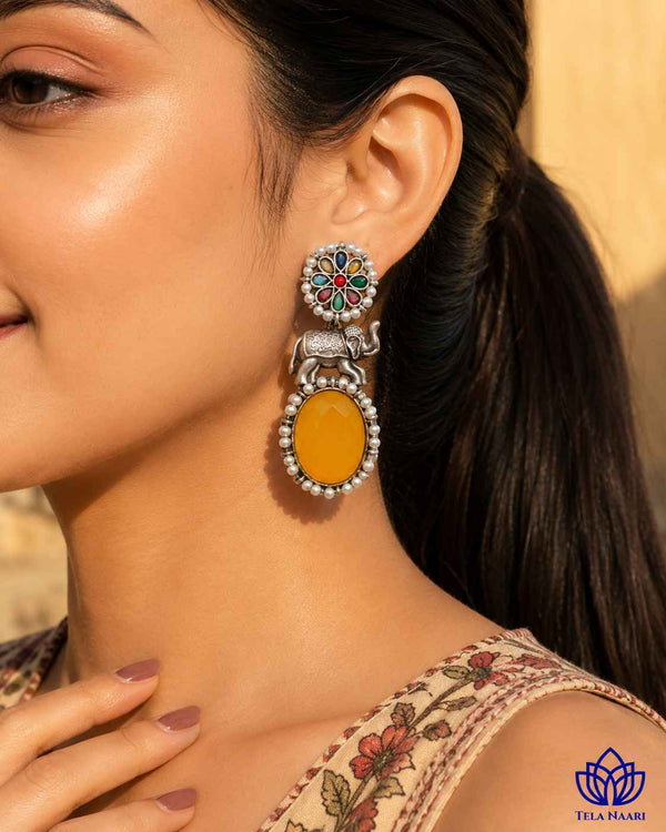 Elephant motif detailing brings whimsical charm to this silver-plated earring.