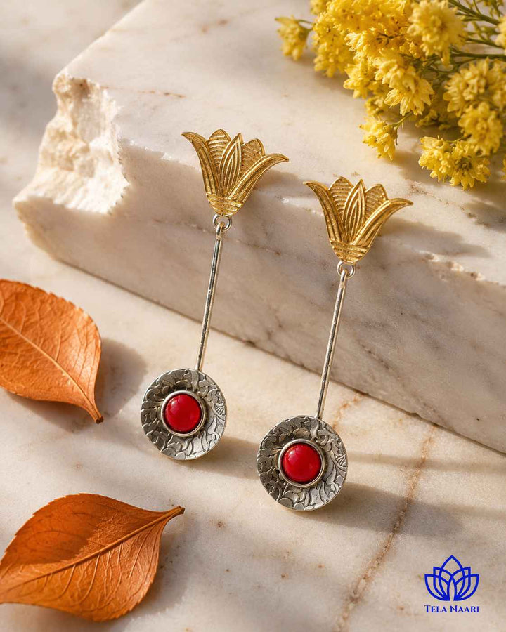 Botanical-inspired teardrop silhouette defines this dual-tone earring design.