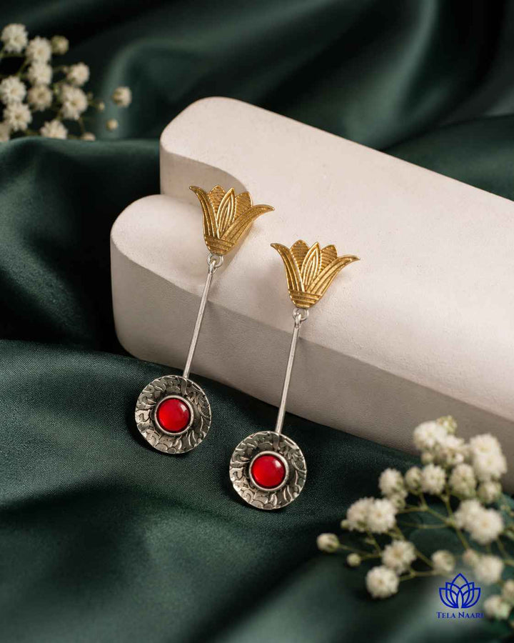 Brass construction forms the base of this teardrop earring shape.