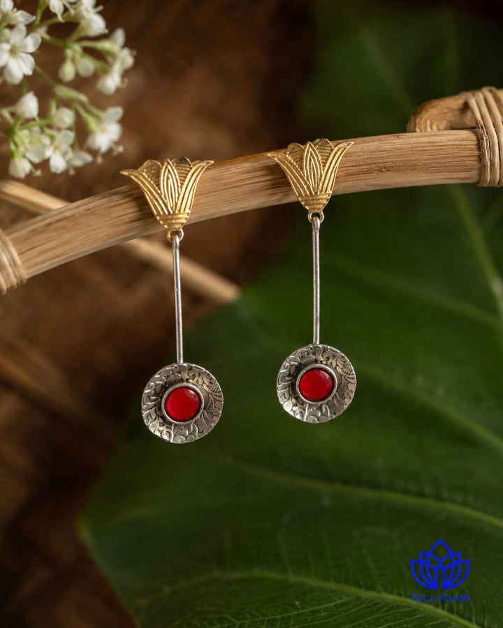Warm and cool tones blend across this dual-tone earring surface.