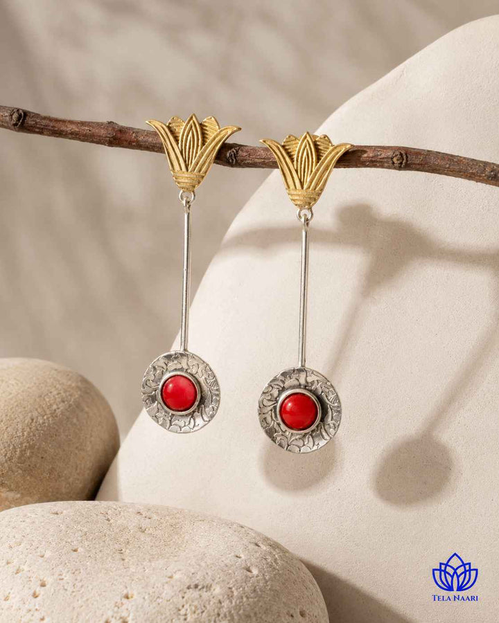 Layered plating creates a soft two-tone finish on this earring.