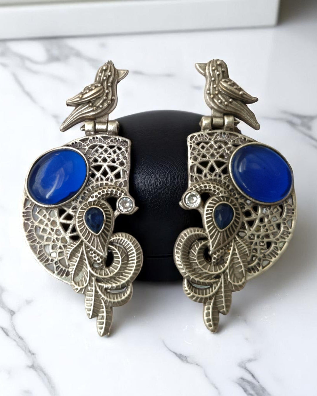 Brass construction underlies the earring&