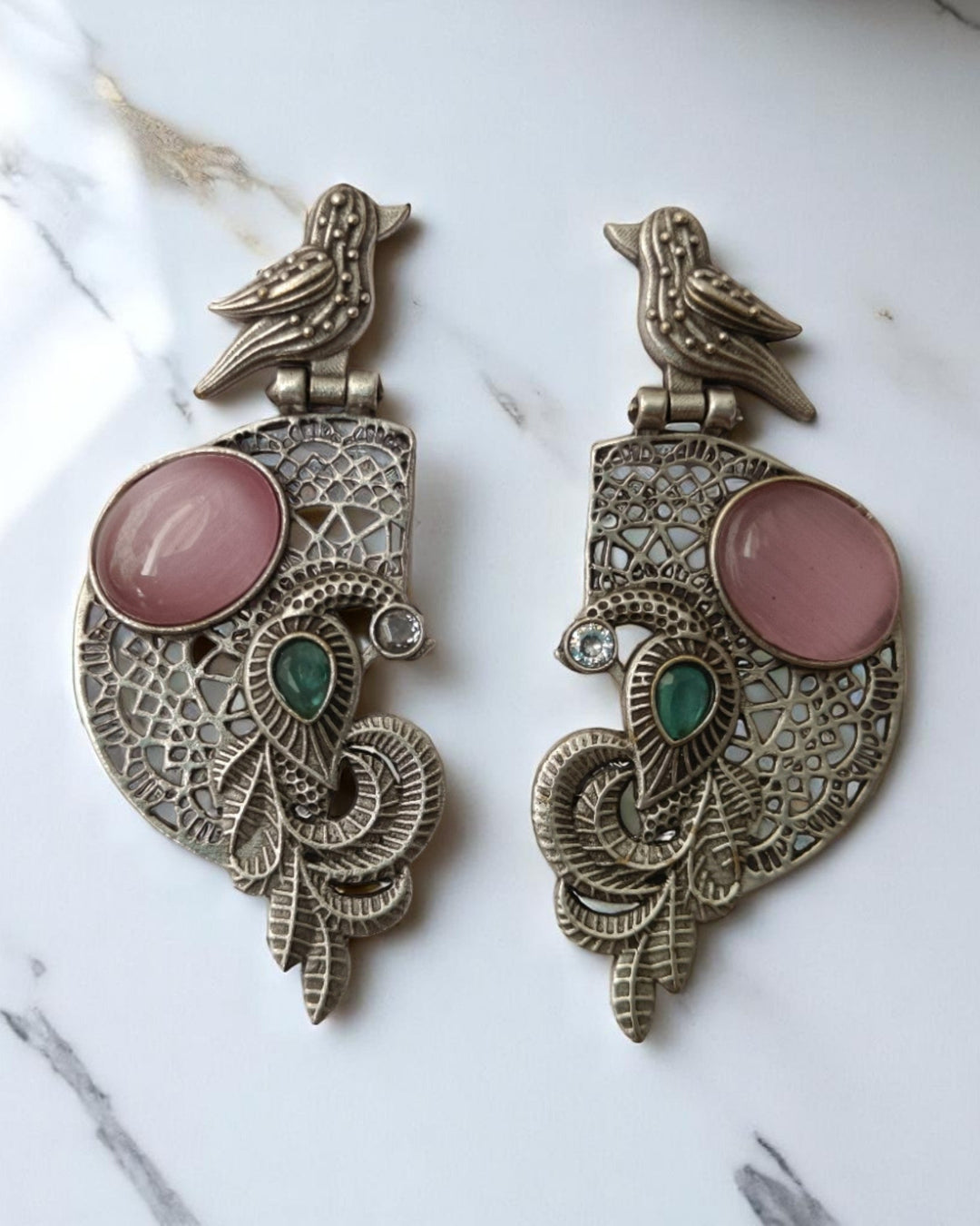Enchanting detailing brings the bird motif to life in silver.