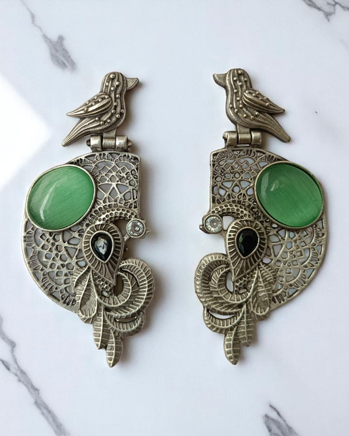 Motif detailing shapes the silhouette of this bird earring.
