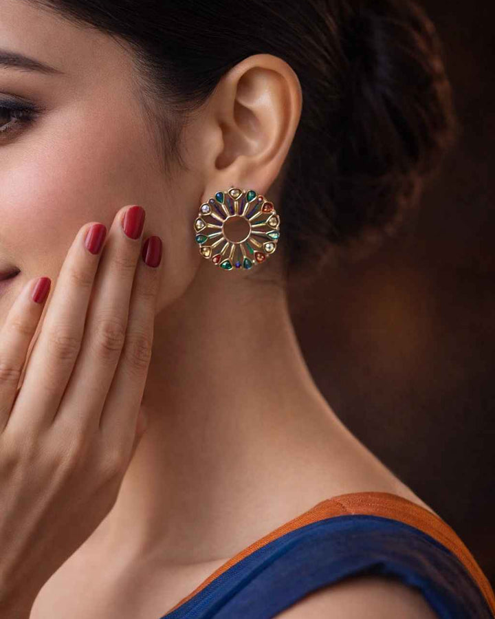Blue accent brings colour to this dual-tone peacock earring.