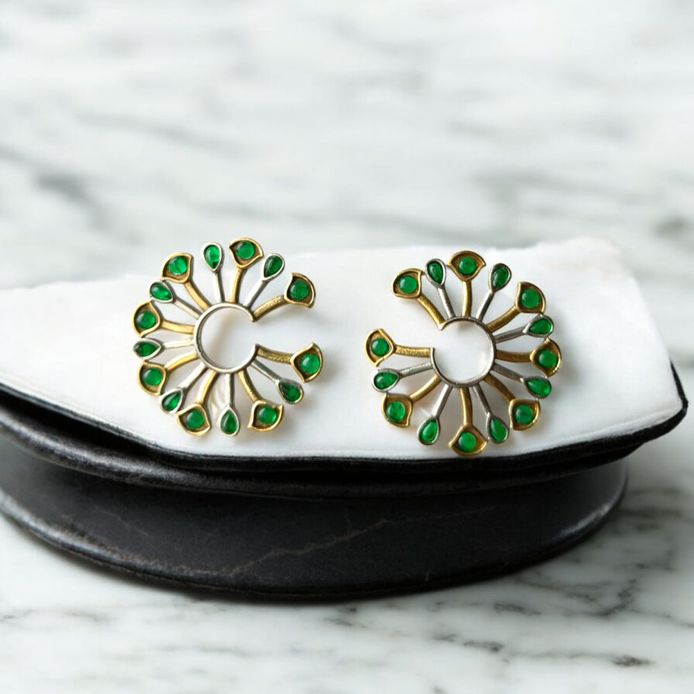 Dual-tone plating covers the surface of this peacock fan earring.