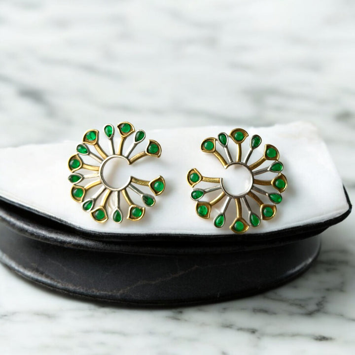 Dual-tone plating covers the surface of this peacock fan earring.