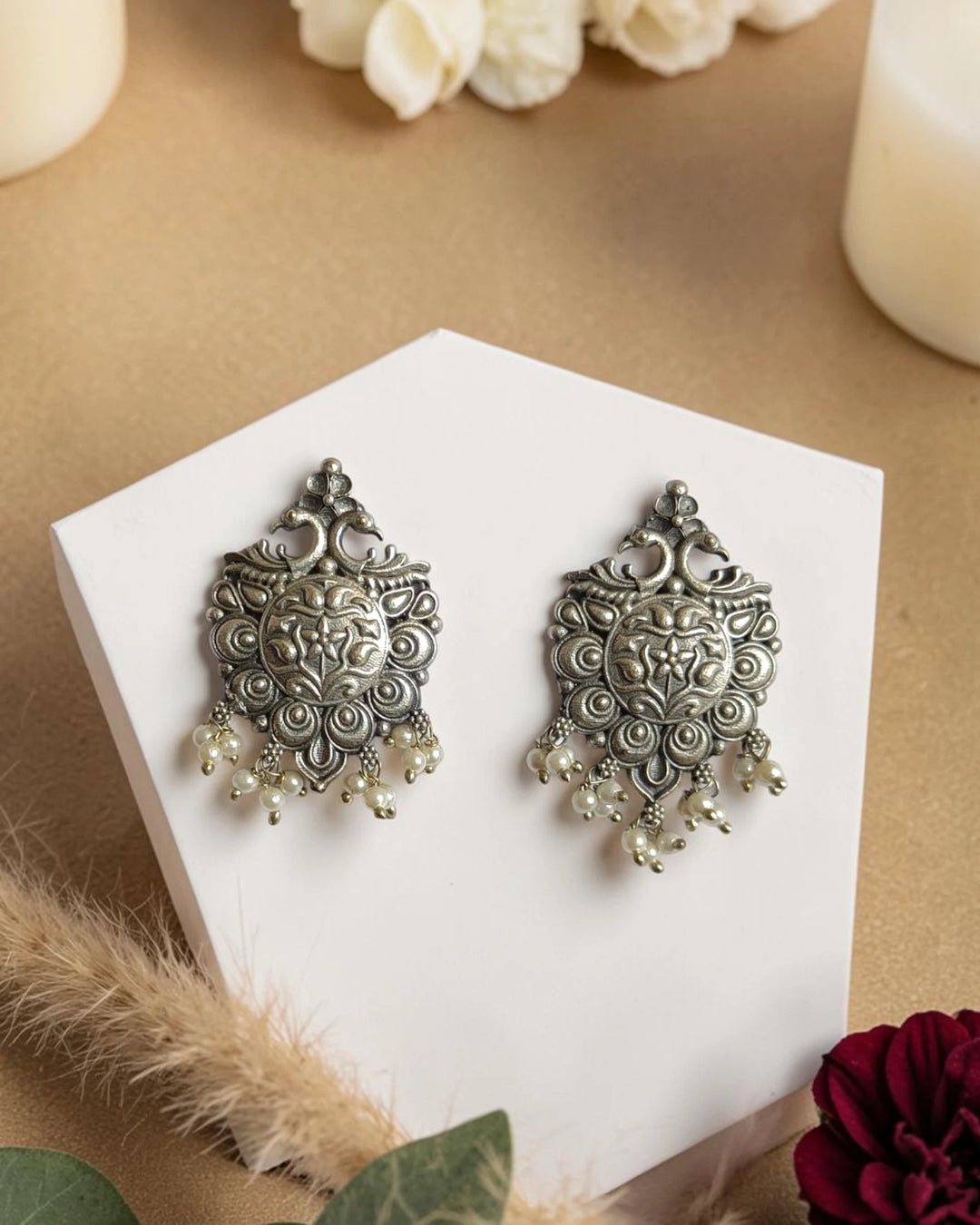 Antiqued finish gives this statement earring its timeless charm.