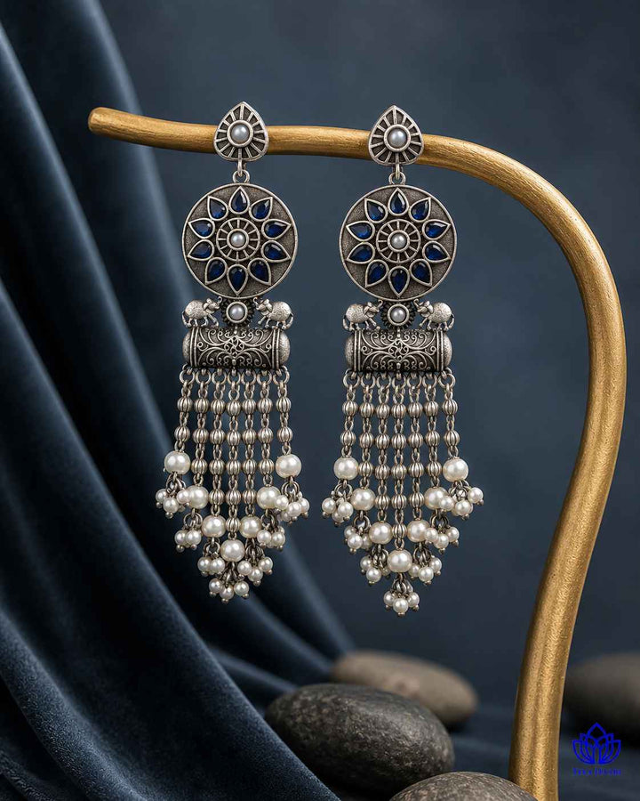 Post-and-back closure secures this silver-plated teardrop earring.