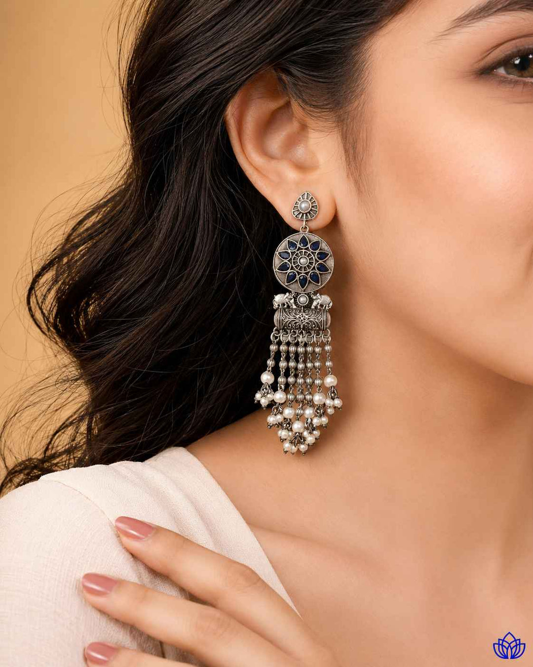 Rounded teardrop shape gives this earring its graceful silhouette.