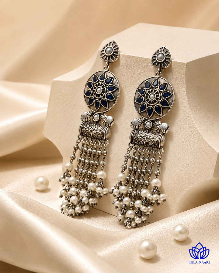 Silver-plated finish covers the smooth surface of this teardrop earring.