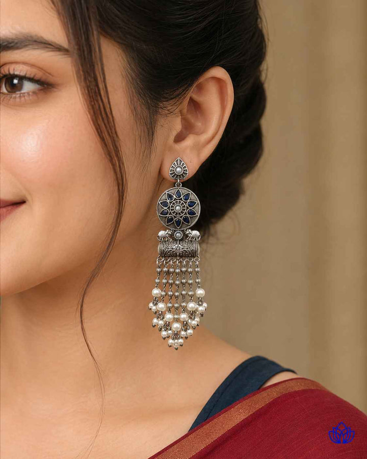Blue tone brightens the teardrop silhouette of this earring.