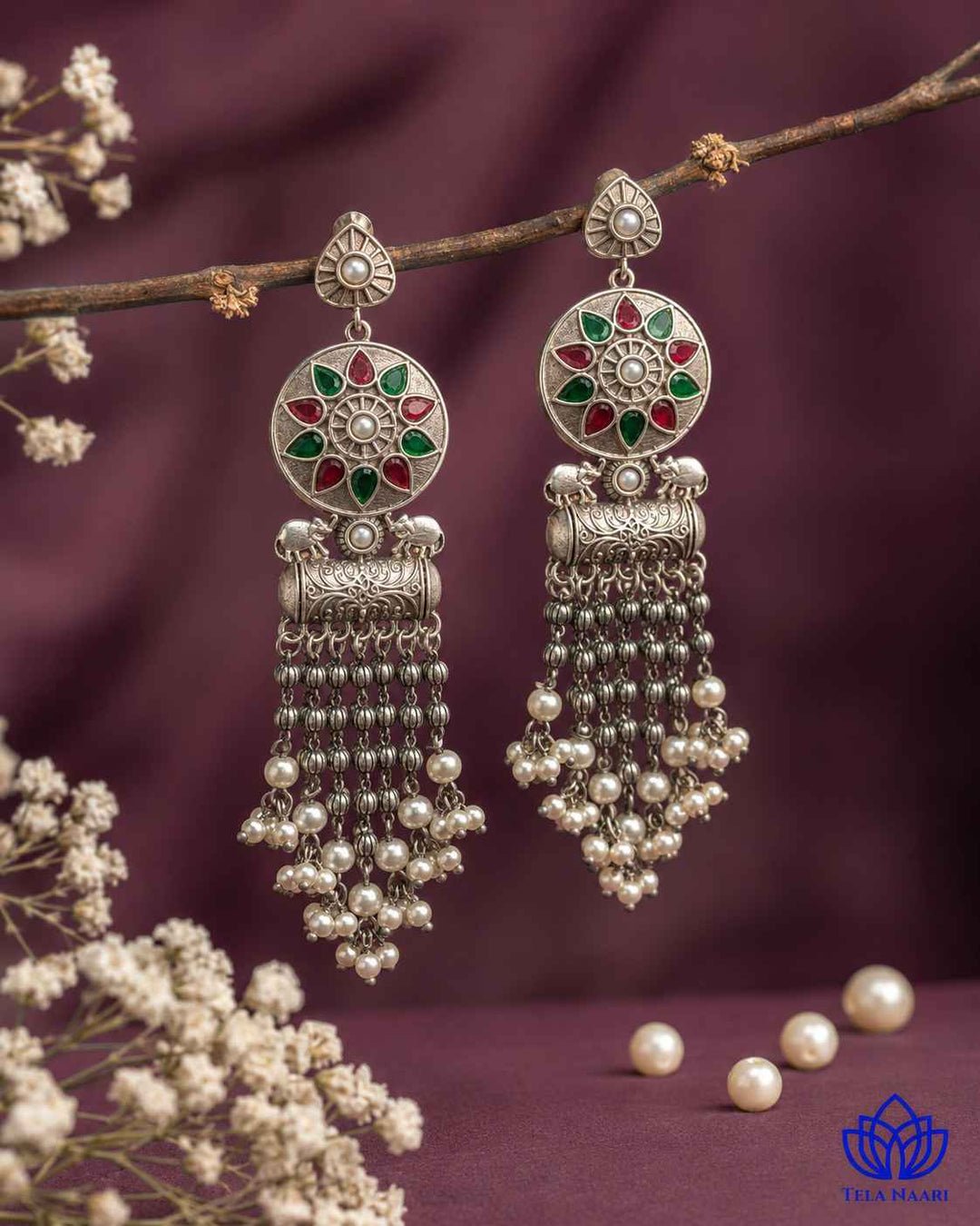 Glass bead detailing adds texture to the red and green design.