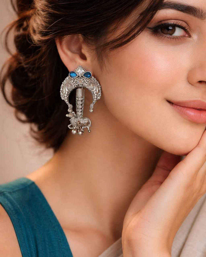 Blue accent brings colour to this silver oxidised tusk earring.